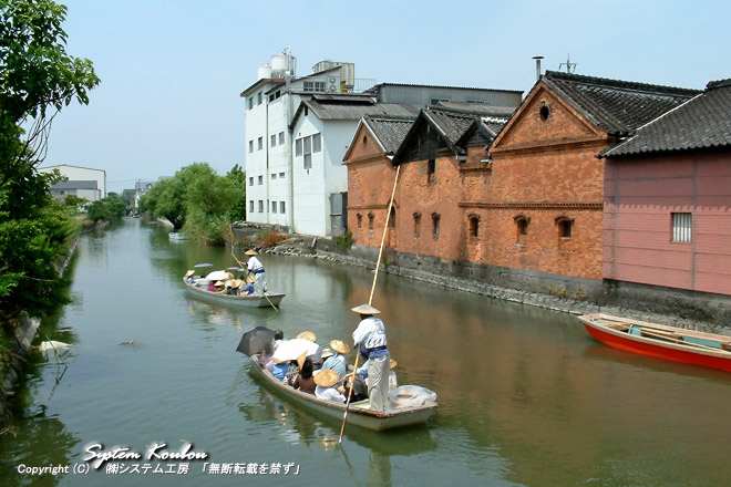 水郷柳川を代表する風景「どんこ舟と並倉（赤レンガ倉庫）」